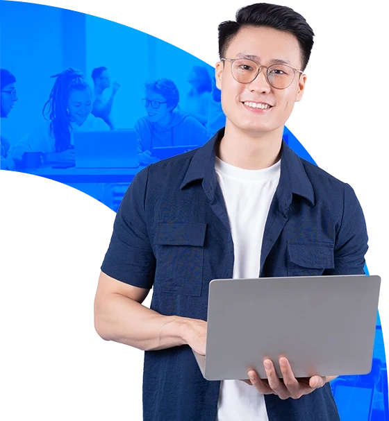 Smiling man working on a laptop for an EdTech solution | LARION