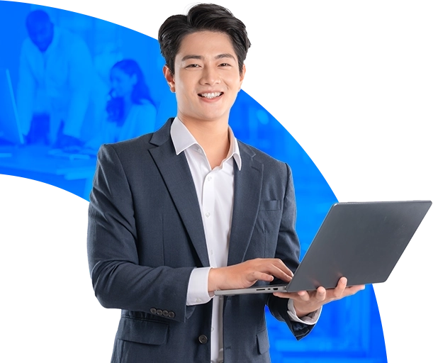 Smiling DevOps engineer working on a laptop | LARION